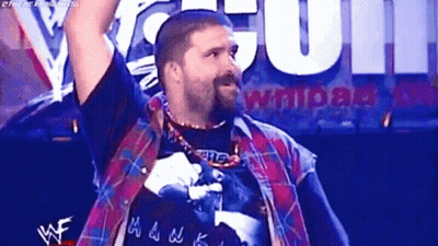 Man With Beard Holding Arms Up In Plaid Shirt GIF