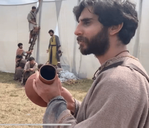 Man With Beard Holding Clay Pot GIF