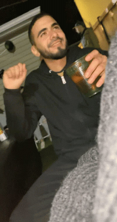 Man With Beard Holding Cup of Beer