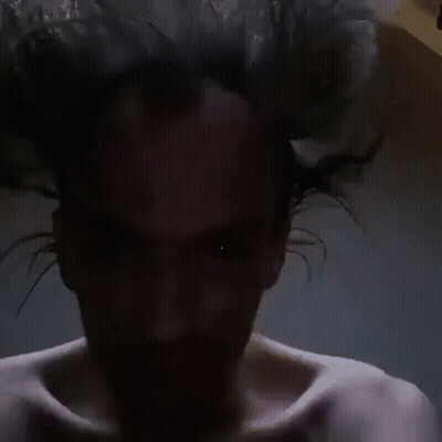 Man With Beard Holding Head GIF