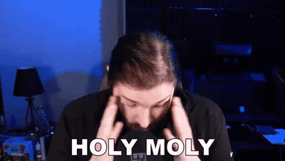 Man With Beard Holding Head Saying Holy Moly GIF