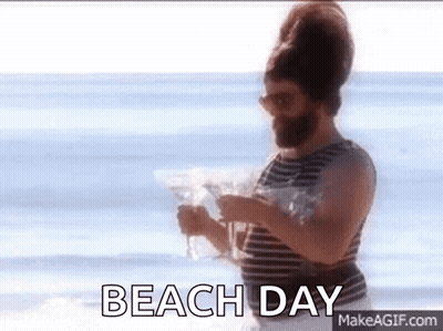 Man With Beard Holding Martini On Beach GIF