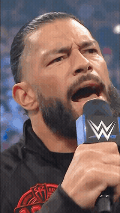 Man With Beard Holding Microphone GIF