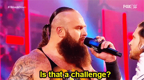 Man With Beard Holding Microphone Talking On Stage GIF