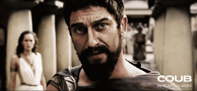 Man With Beard Holding Shield In Front Of Woman GIF