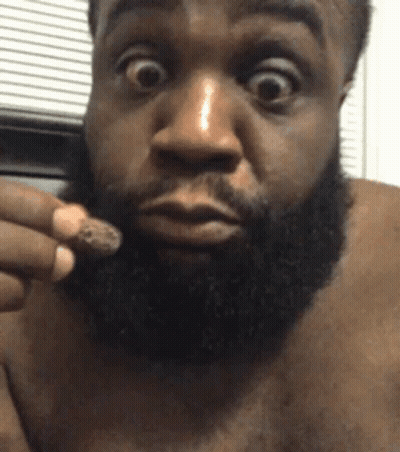 Man With Beard Holding Something GIF