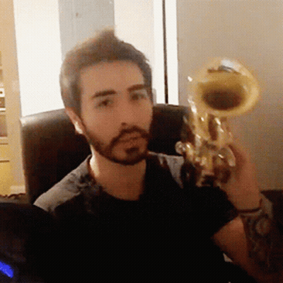Man With Beard Holding Trumpet GIF