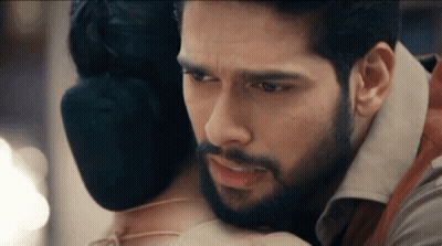Man With Beard Hugging Woman With Bloody Face GIF