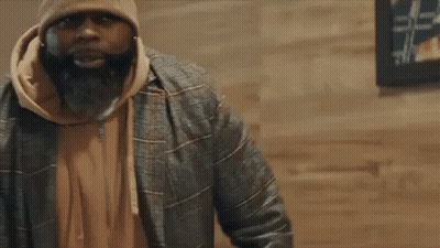 Man With Beard In Beanie And Jacket Talking To Another Man GIF
