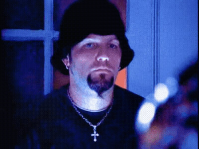 Man With Beard In Black Hat And Cross Necklace GIF