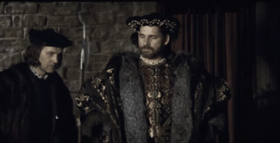 Man With Beard In Black Hat And Fur Coat GIF