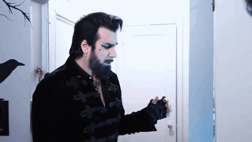 Man With Beard In Black Jacket And Gloves GIF