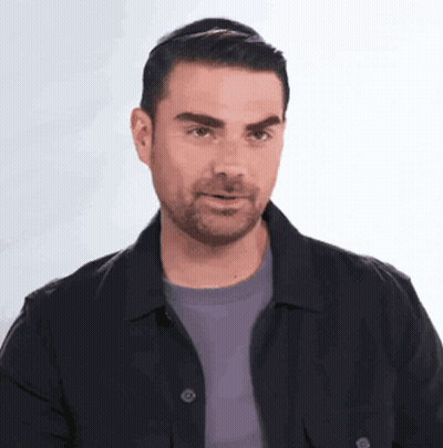 Man With Beard In Black Jacket And Purple Shirt GIF