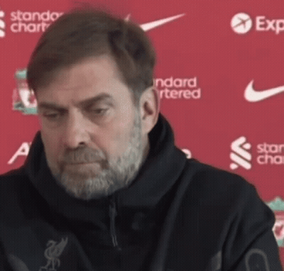 Man With Beard In Black Jacket Says Standard Chartered GIF
