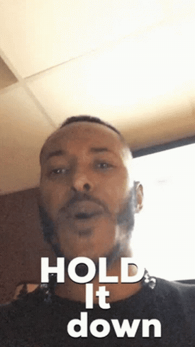 Man With Beard In Black Shirt Says Hold It Down GIF