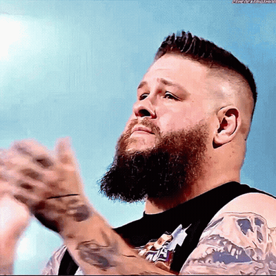 Man With Beard In Black Snickers Shirt GIF