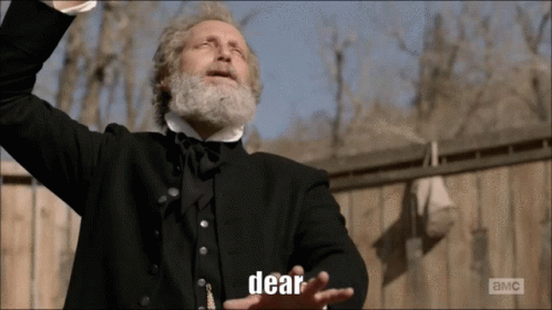 Man With Beard In Black Suit Says Dear GIF
