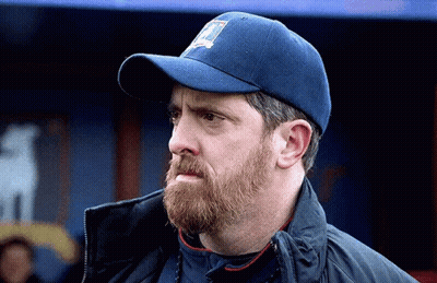 Man With Beard in Blue Baseball Cap and Jacket