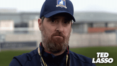 Man With Beard In Blue Hat Saying Ted Lasso GIF