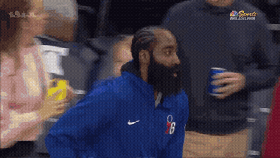 Man With Beard In Blue Nike Jacket In Crowd GIF