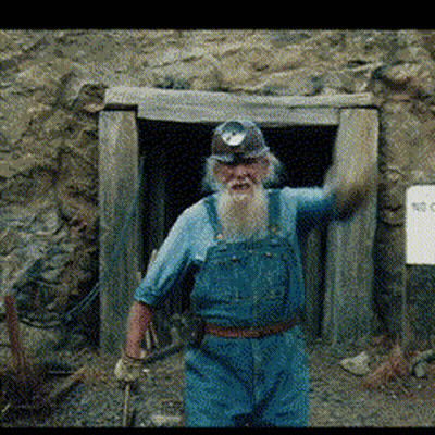 Man With Beard In Blue Overalls And Hard Hat GIF