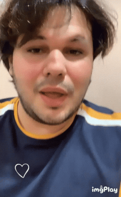 Man With Beard In Blue Shirt And White Heart GIF