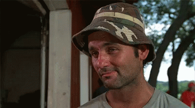 Man With Beard In Camouflage Hat Looking At Camera GIF