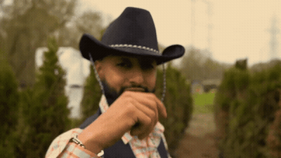 Man With Beard In Cowboy Hat And Plaid Shirt GIF