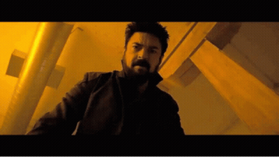 Man With Beard In Dark Room With Yellow Lights GIF