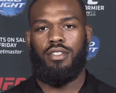 Man With Beard In Front Of Bud Light Sign GIF