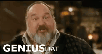 Man With Beard In Front Of Geniusjat Sign GIF