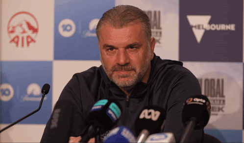 Man With Beard In Front Of Melbourne Sign GIF