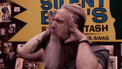 Man With Beard In Front Of Silent Bash Sign GIF