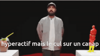 Man With Beard In Front Of Statue GIF