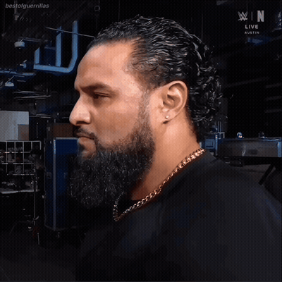Man With Beard In Front Of WWE Live Austin Sign GIF
