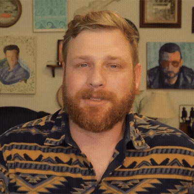 Man With Beard In Geometric Pattern Shirt GIF