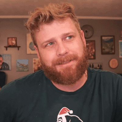 Man With Beard In Green T-Shirt With Santa GIF
