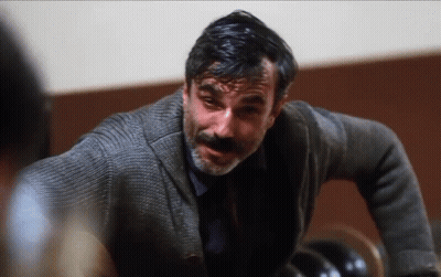 Man With Beard In Grey Sweater And Blue Shirt GIF