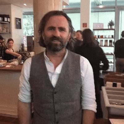 Man With Beard In Grey Vest GIF