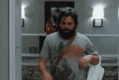 Man With Beard In Hallway GIF