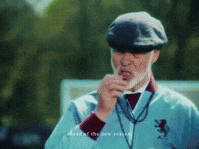 Man With Beard In Hat And Blue Jacket With Lion GIF