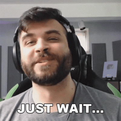 Man With Beard In Headphones Says Just Wait GIF