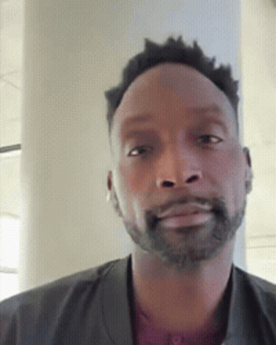 Man With Beard In Jacket And Red Shirt GIF