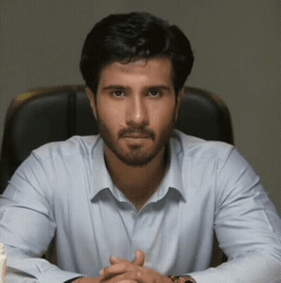 Man With Beard In Light Blue Shirt Sitting GIF