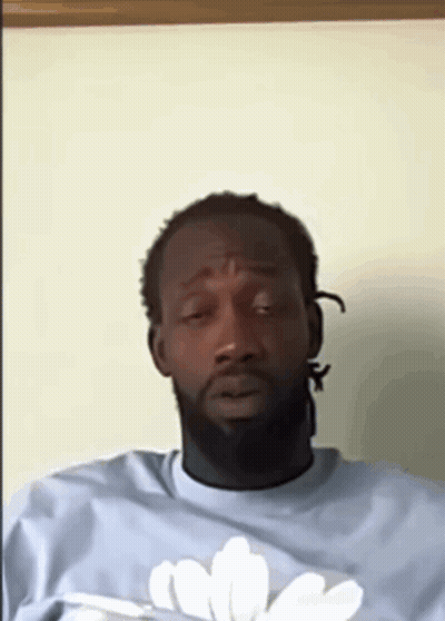 Man With Beard In Light Blue Shirt With White Flower GIF