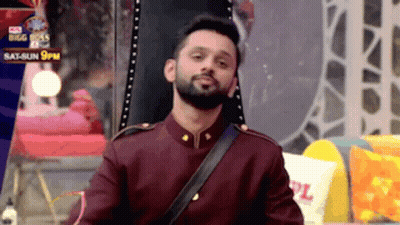 Man With Beard In Maroon Uniform And Black Shoulder Strap GIF