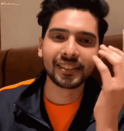 Man With Beard In Orange Shirt And Blue Jacket GIF