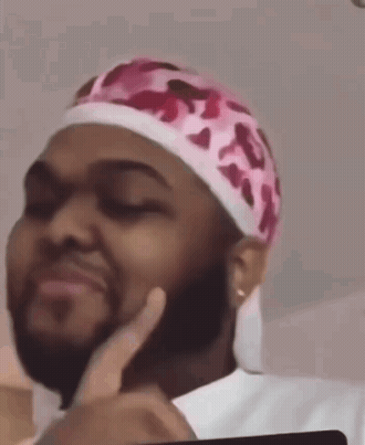 Man With Beard In Pink Headband Making Face GIF