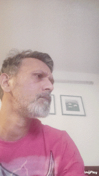 Man With Beard In Pink Shirt With Boat GIF
