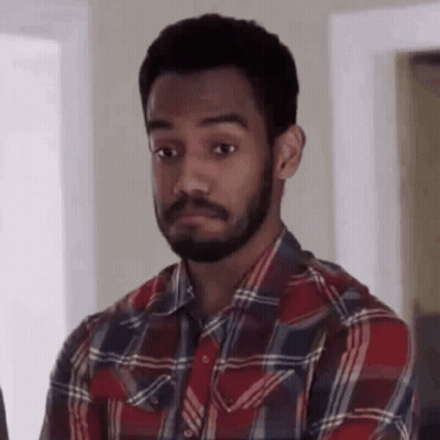 Man With Beard In Plaid Shirt Making Face GIF